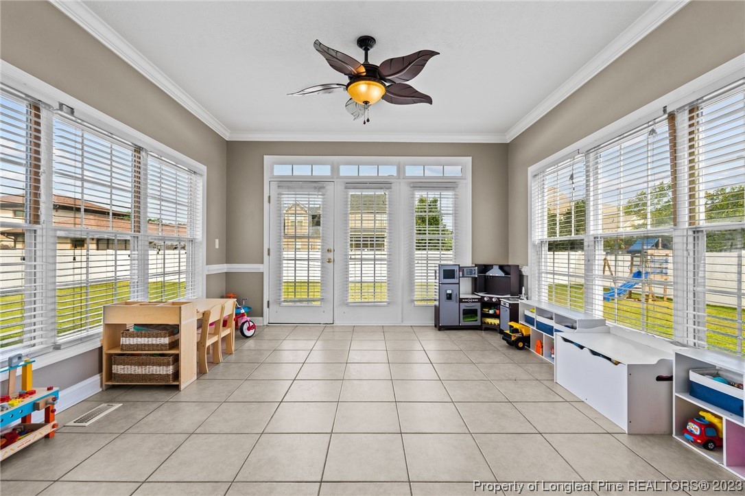 6407 Cattesmore Road Fayetteville, NC 28311 - Photo 22 of 42 a living room with furniture and large windows