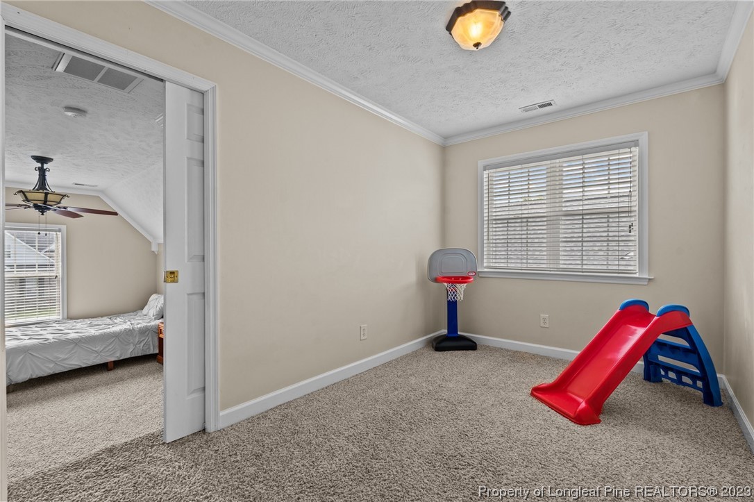 6407 Cattesmore Road Fayetteville, NC 28311 - Photo 27 of 42 a bedroom with a bed and a window
