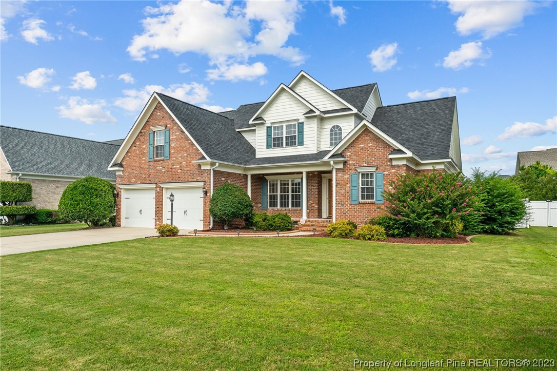 6407 Cattesmore Road Fayetteville, NC 28311 - Photo 31 of 42 a front view of a house with a yard