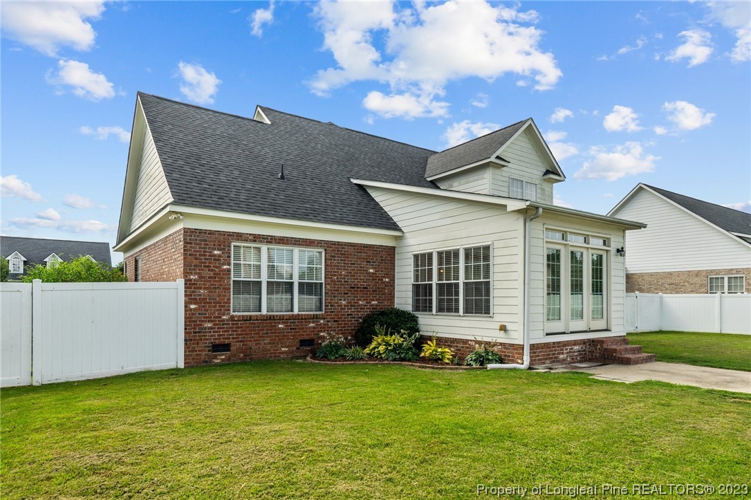 6407 Cattesmore Road Fayetteville, NC 28311 - Photo 37 of 42 a front view of a house with a garden