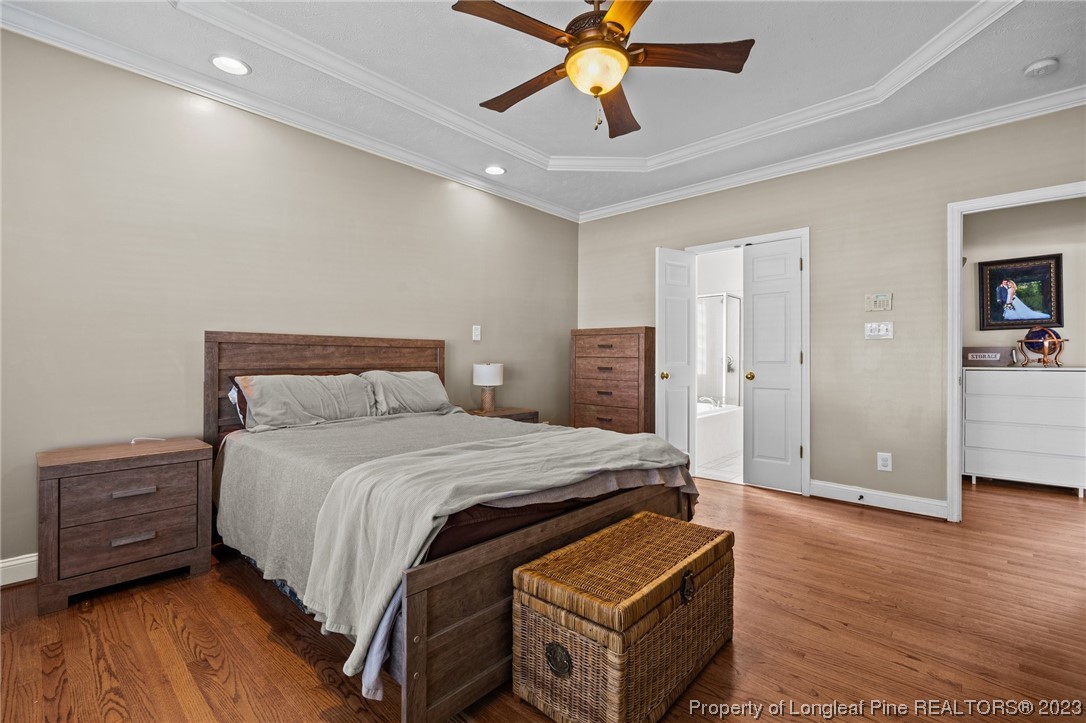 6407 Cattesmore Road Fayetteville, NC 28311 - Photo 5 of 42 a bedroom with a bed and a ceiling fan