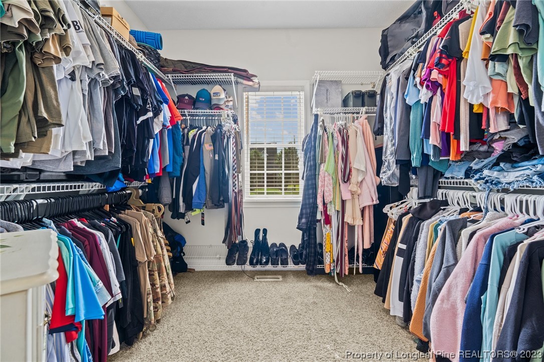6407 Cattesmore Road Fayetteville, NC 28311 - Photo 8 of 42 a view of walk in closet with clothes