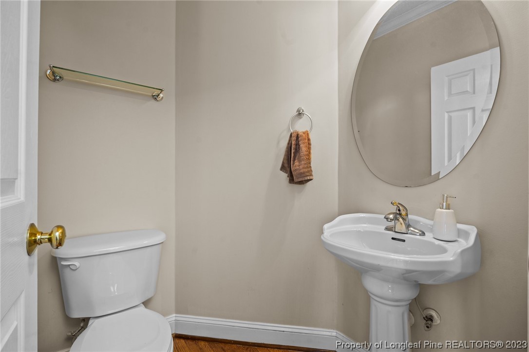 6407 Cattesmore Road Fayetteville, NC 28311 - Photo 9 of 42 a bathroom with a sink toilet and a mirror
