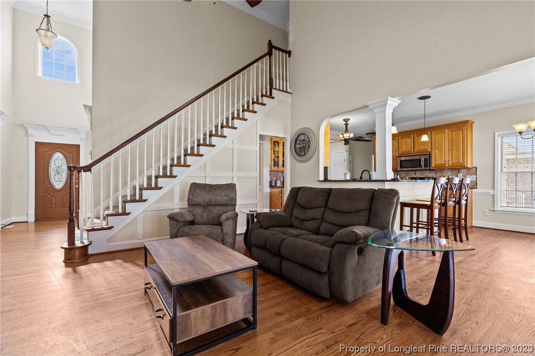 6407 Cattesmore Road Fayetteville, NC 28311 - Photo 10 of 42 a living room with furniture and wooden floor
