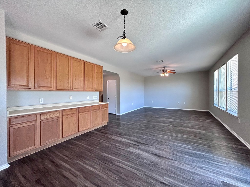 8916 Ipswich Bay Drive Austin, TX 78747 - Photo 14 of 39 a view of a kitchen with a sink and wooden floor