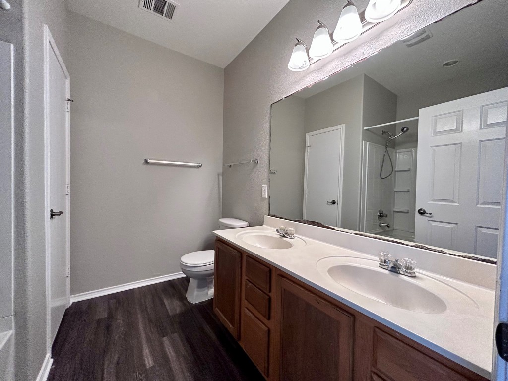 8916 Ipswich Bay Drive Austin, TX 78747 - Photo 17 of 39 a bathroom with a double vanity sink and a mirror