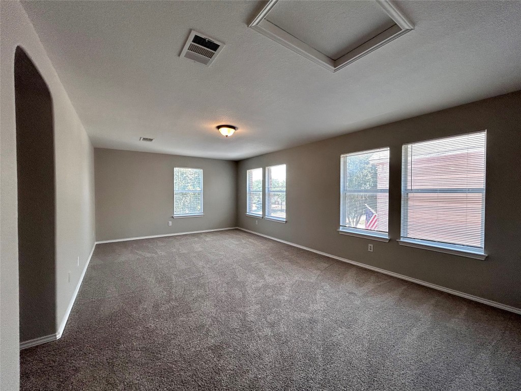 8916 Ipswich Bay Drive Austin, TX 78747 - Photo 22 of 39 a view of an empty room with a window