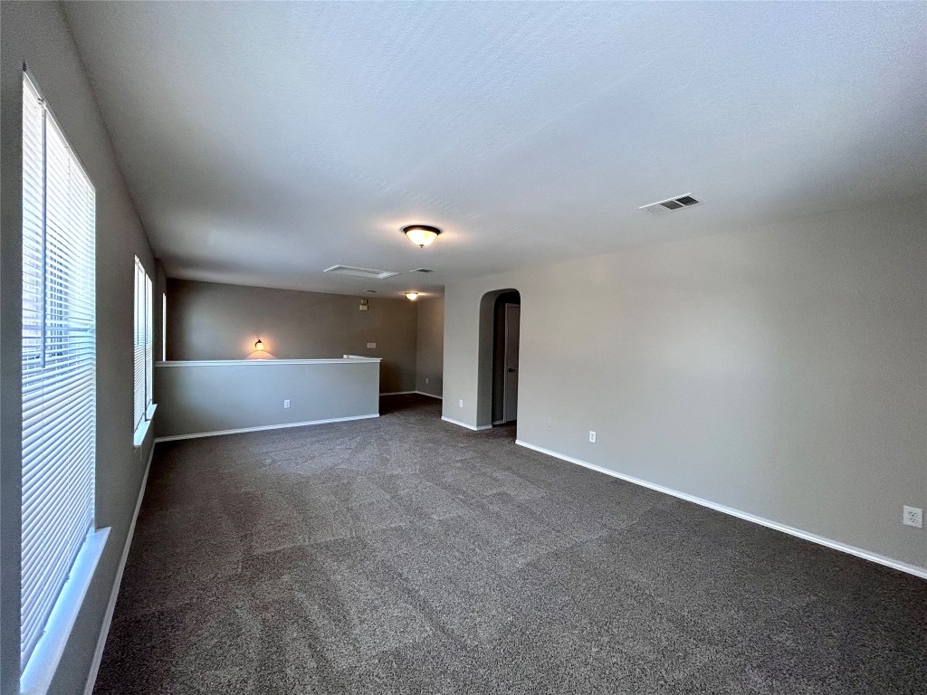 8916 Ipswich Bay Drive Austin, TX 78747 - Photo 23 of 39 a view of empty room with window and fireplace