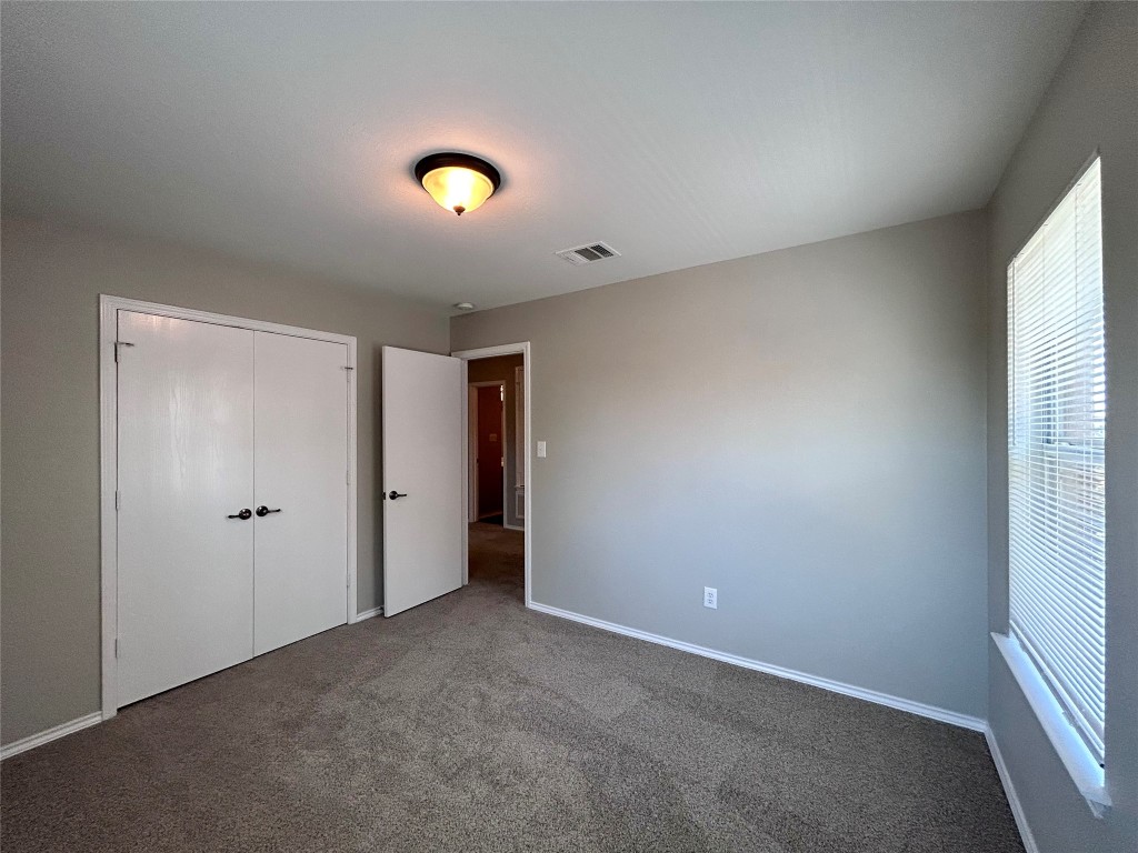 8916 Ipswich Bay Drive Austin, TX 78747 - Photo 29 of 39 a view of an empty room with a window