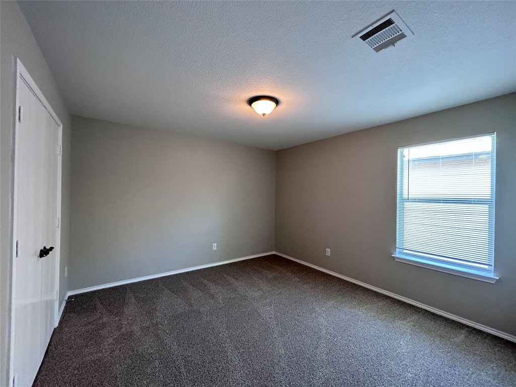 8916 Ipswich Bay Drive Austin, TX 78747 - Photo 31 of 39 an empty room with a window