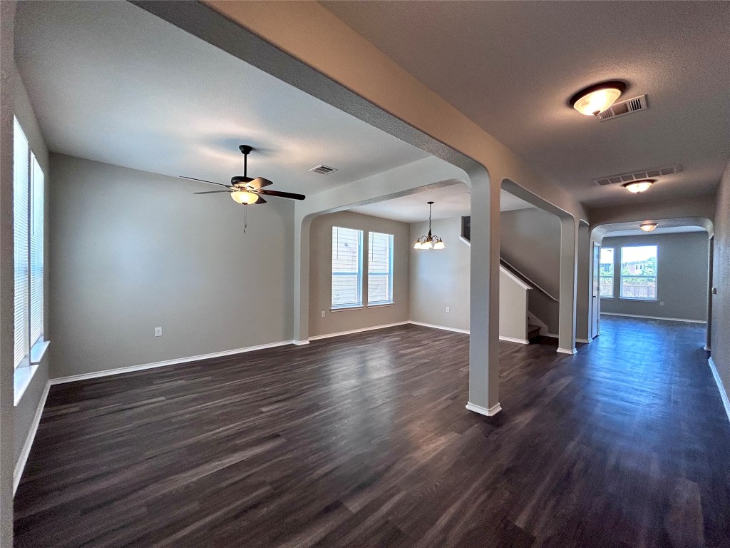 8916 Ipswich Bay Drive Austin, TX 78747 - Photo 4 of 39 a view of an empty room with wooden floor and a window