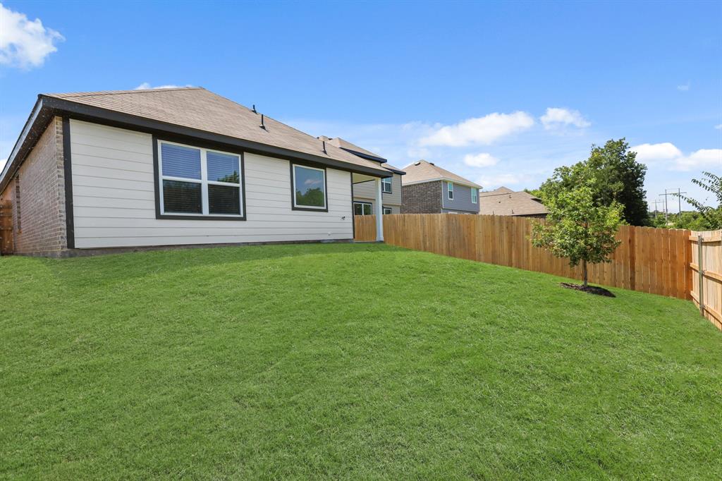 1508 Romans Road Ennis, TX 75119 - Photo 18 of 19 a front view of house with yard and green space