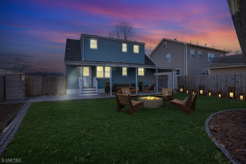 a front view of a house with garden and patio