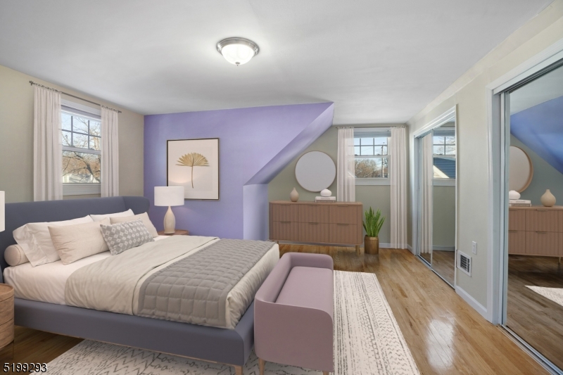 8 Corsi Road Bloomfield, NJ 07003 - Photo 5 of 11 a bedroom with a bed and a mirror