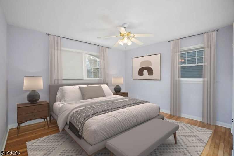 8 Corsi Road Bloomfield, NJ 07003 - Photo 7 of 11 a bedroom with a bed and wooden floor