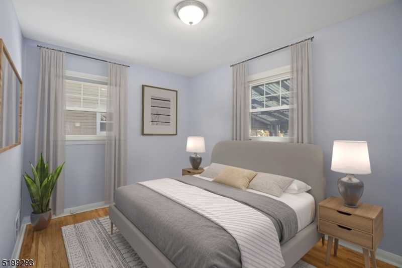 8 Corsi Road Bloomfield, NJ 07003 - Photo 8 of 11 a bedroom with a bed and a window