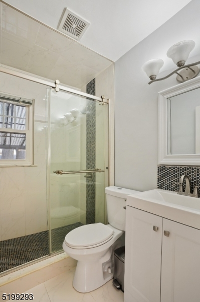 8 Corsi Road Bloomfield, NJ 07003 - Photo 9 of 11 a bathroom with a toilet sink and shower