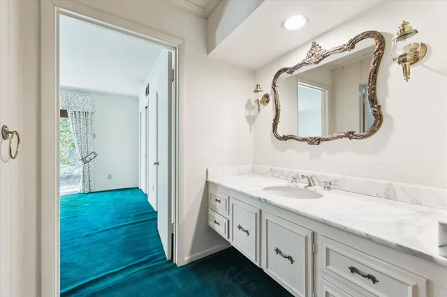 a spacious bathroom with a double vanity sink and a mirror