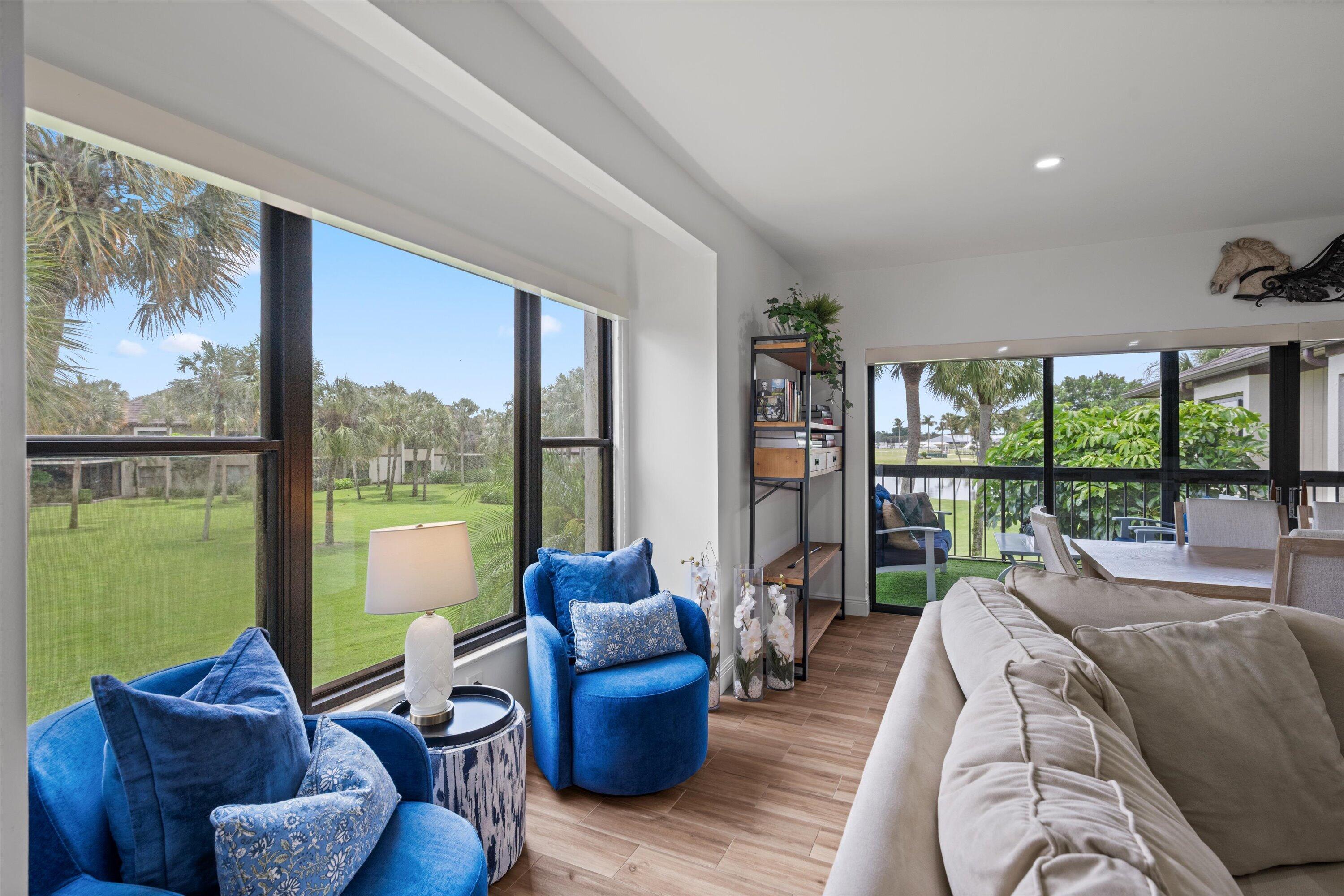13400 Polo Road West, Unit 203 Wellington, FL 33414 - Photo 5 of 26 a living room with furniture and a floor to ceiling window