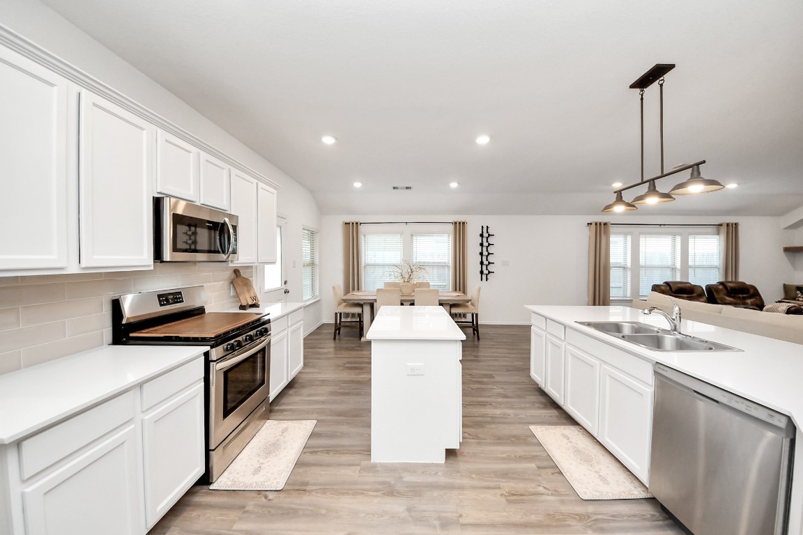 2835 Mistygate Court Conroe, TX 77301 - Photo 13 of 35 Designed for both cooking and connection, this kitchen offers ample workspace and a layout that brings everyone together.
