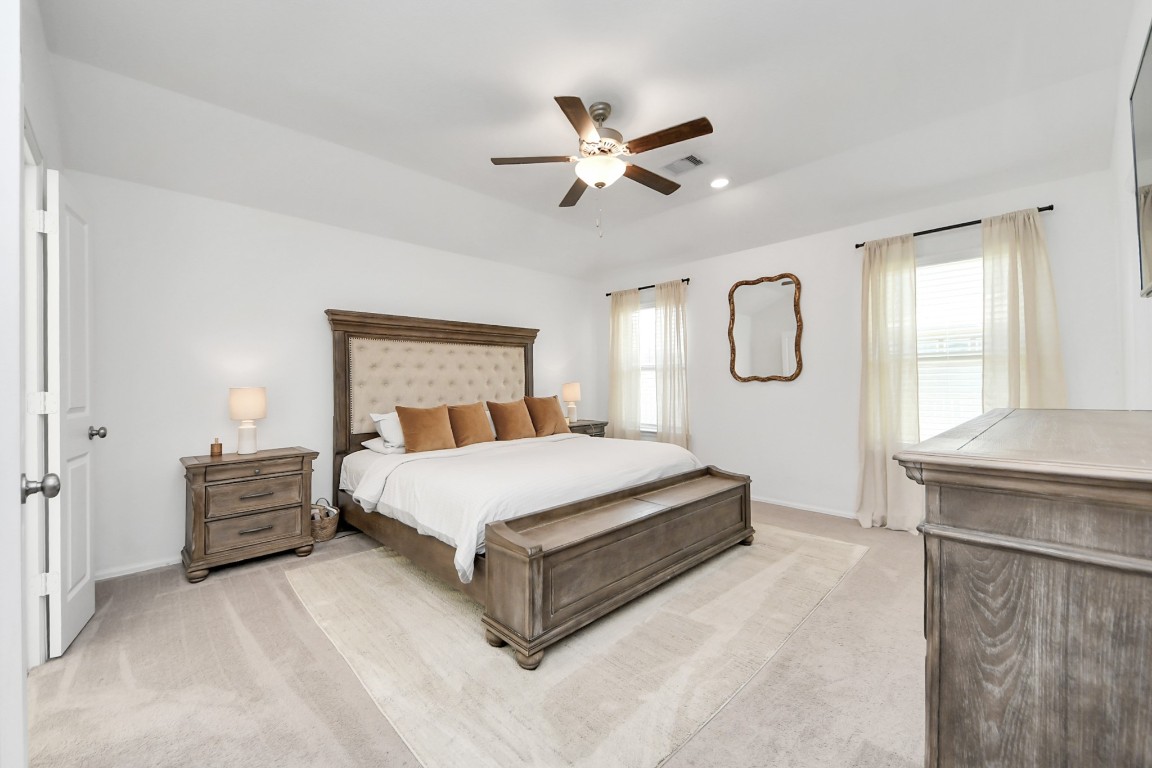 2835 Mistygate Court Conroe, TX 77301 - Photo 15 of 35 Spacious primary suite with soft natural light and a layout designed for comfort and relaxation.