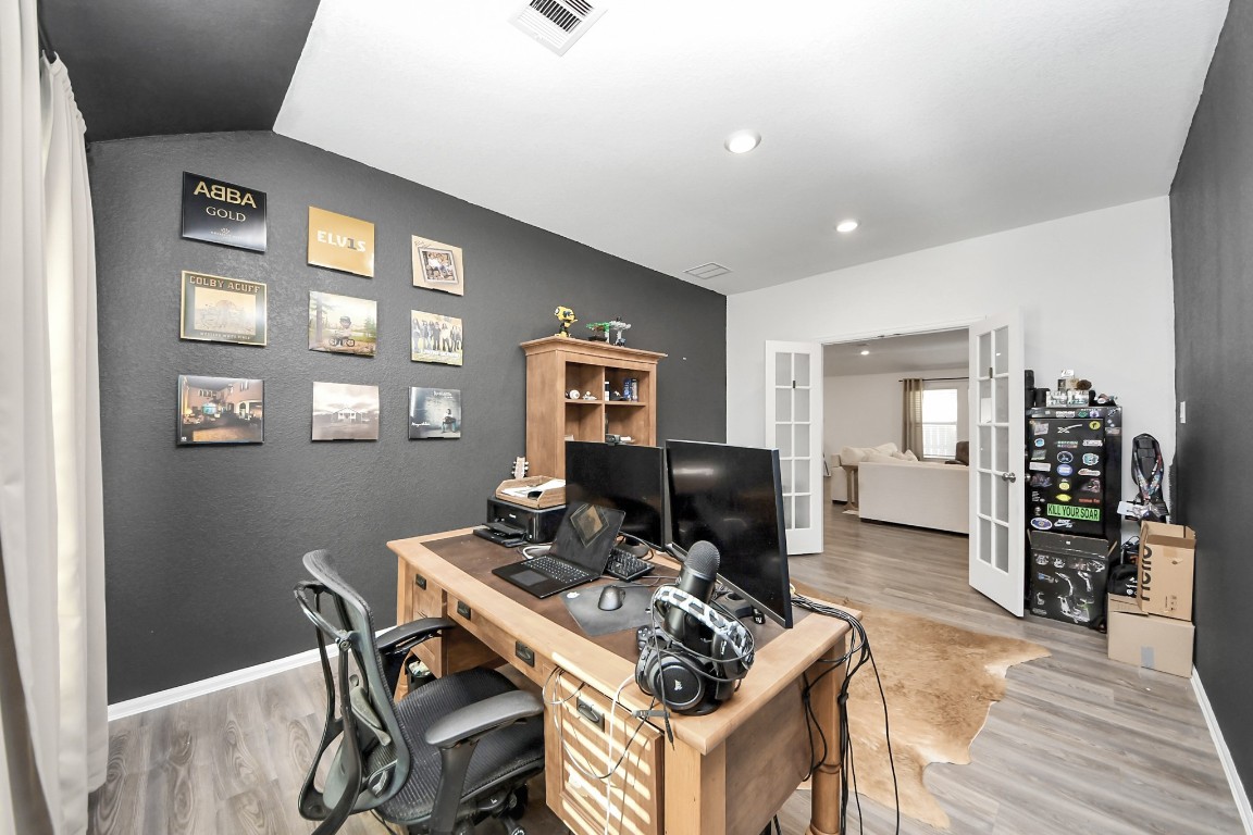 2835 Mistygate Court Conroe, TX 77301 - Photo 21 of 35 Flexible space with double doors, perfect for a home office, media room, or creative workspace.