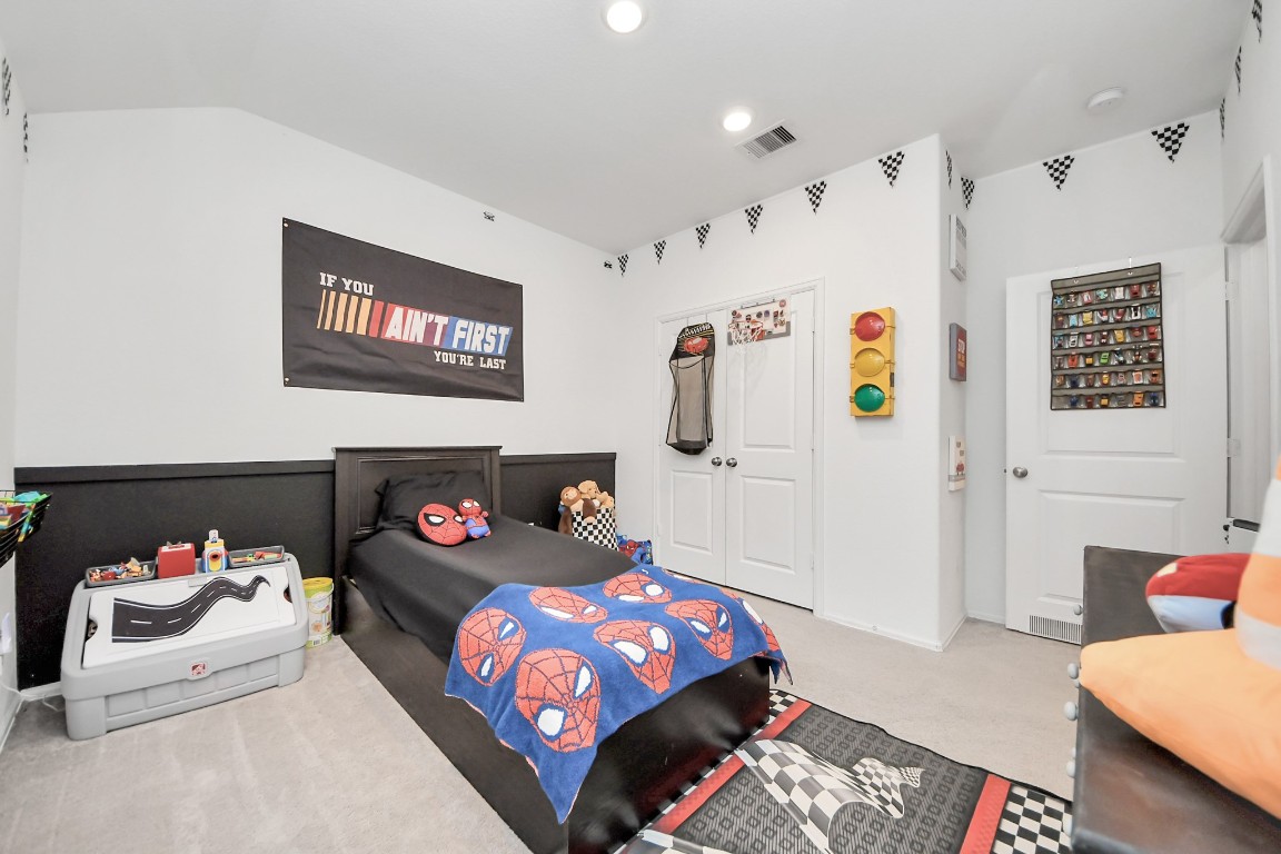 2835 Mistygate Court Conroe, TX 77301 - Photo 23 of 35 Comfortable secondary bedroom offering flexibility for a variety of needs, from a bedroom to a playroom or hobby space.