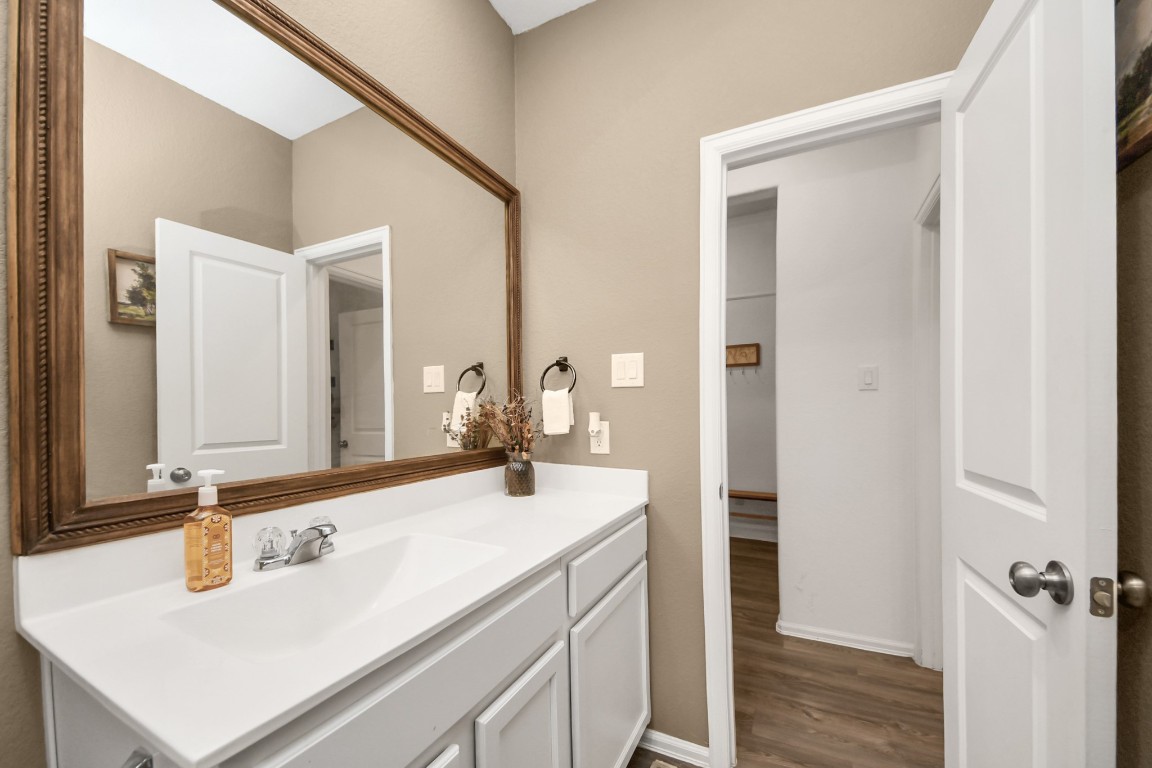 2835 Mistygate Court Conroe, TX 77301 - Photo 27 of 35 Well-appointed secondary bathroom with ample counter space and easy access from nearby bedrooms.