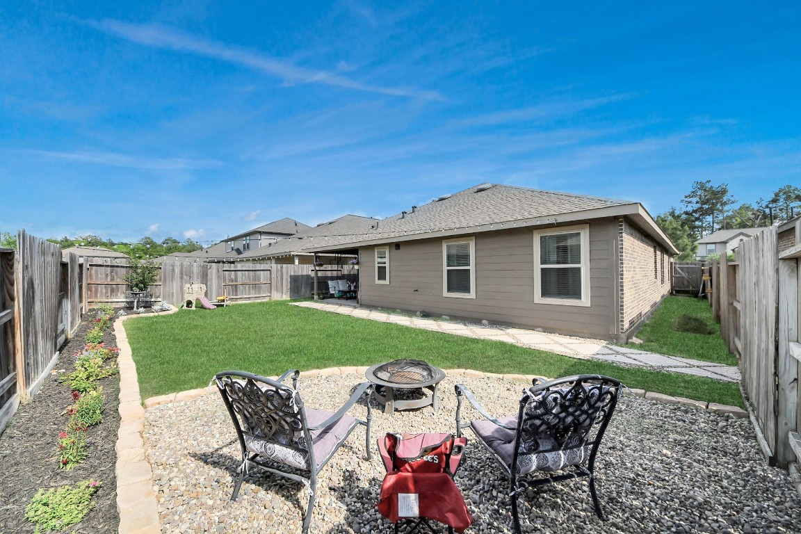 2835 Mistygate Court Conroe, TX 77301 - Photo 29 of 35 Spacious backyard with plenty of green space, perfect for relaxing, playing, or entertaining.