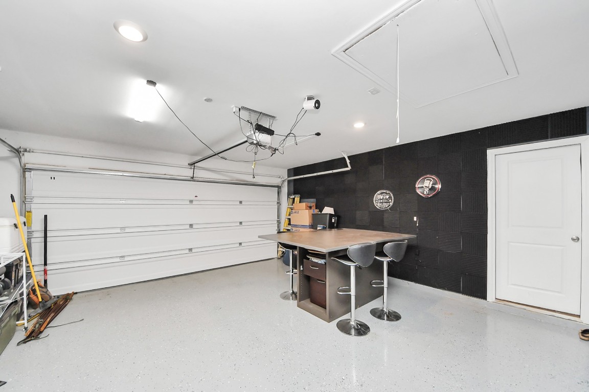 2835 Mistygate Court Conroe, TX 77301 - Photo 33 of 35 Conditioned garage can be used as a man cave, home gym, or hobby area.