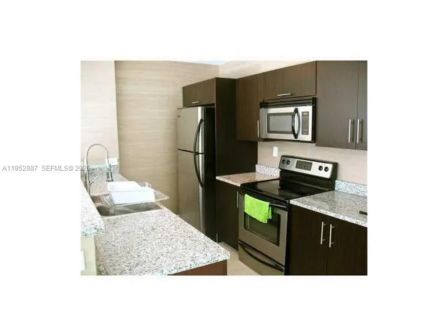 a view of a living room and dining room