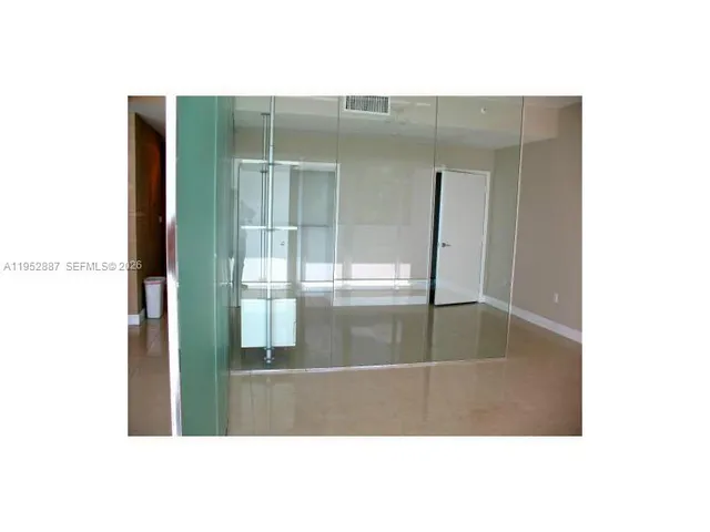 a kitchen with stainless steel appliances kitchen island a refrigerator sink and stove