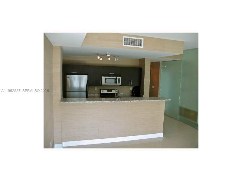 2694 Inagua Avenue, Unit 303 Coconut Grove, FL 33133 - Photo 10 of 18 a view of a living room with kitchen