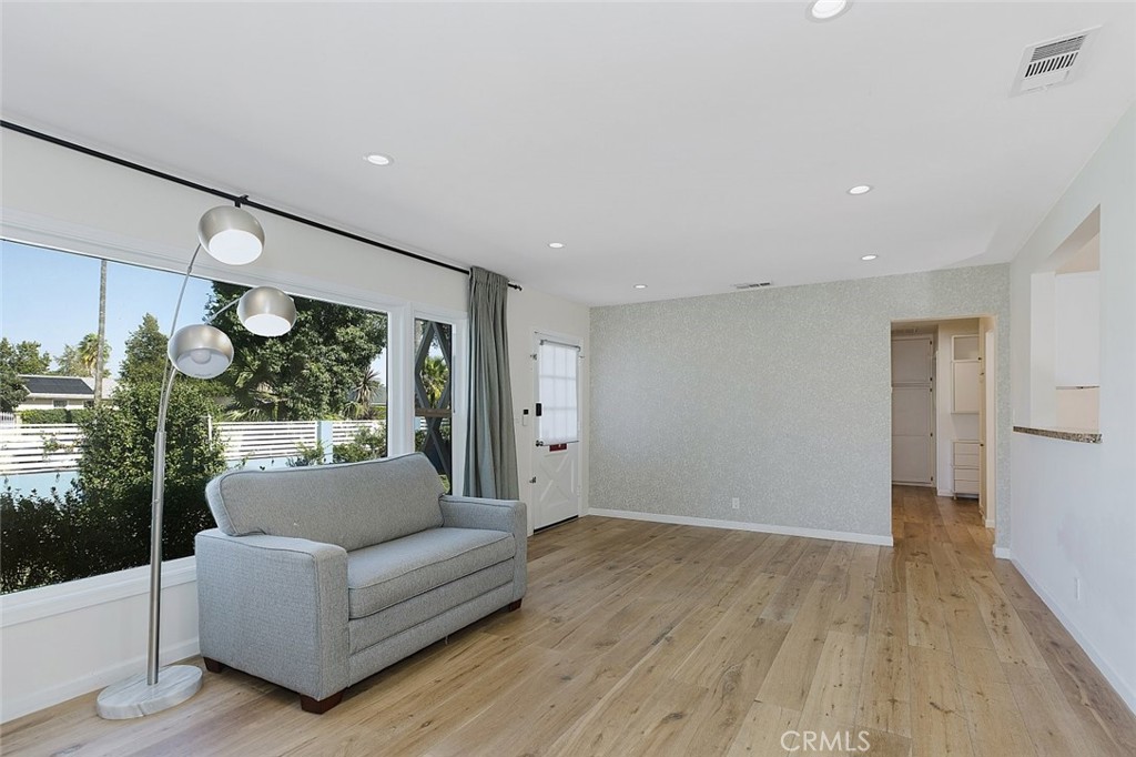 17134 Sherman Way Lake Balboa, CA 91406 - Photo 12 of 27 a living room with furniture and a large window