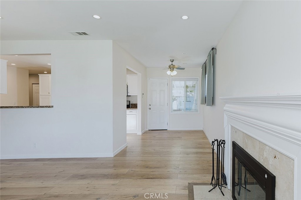 17134 Sherman Way Lake Balboa, CA 91406 - Photo 18 of 27 a view of a livingroom with wooden floor and a fireplace