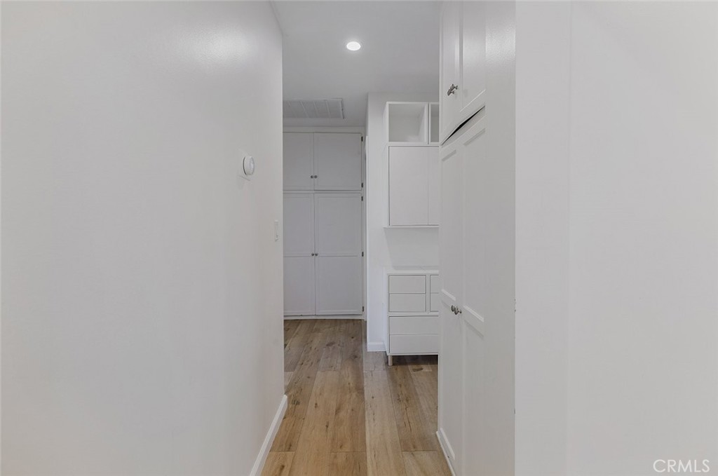 17134 Sherman Way Lake Balboa, CA 91406 - Photo 20 of 27 a view of a hallway with wooden floor