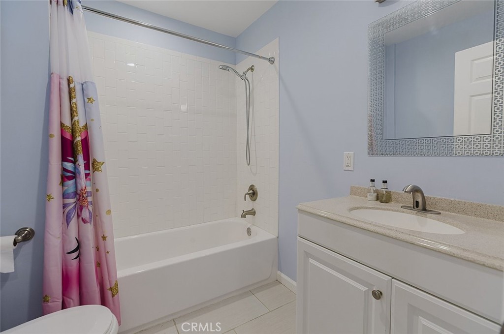 17134 Sherman Way Lake Balboa, CA 91406 - Photo 22 of 27 a bathroom with a sink and a bathtub