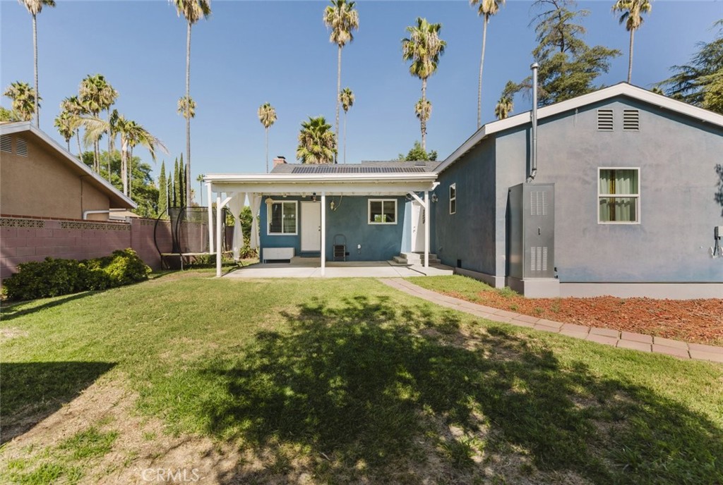 17134 Sherman Way Lake Balboa, CA 91406 - Photo 6 of 27 a front view of a house with garden