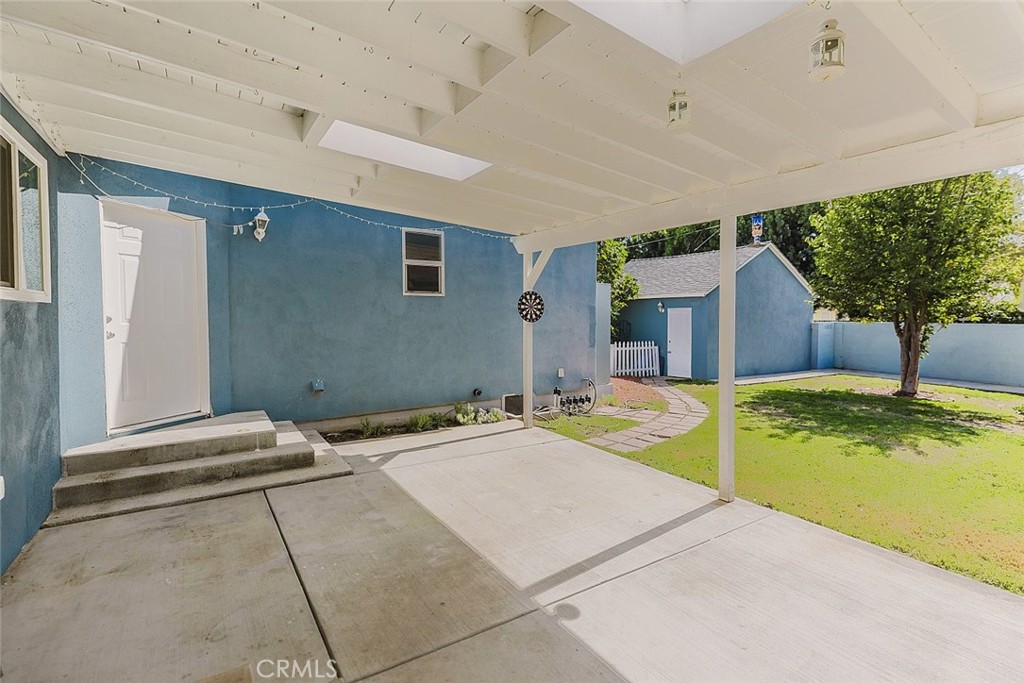 17134 Sherman Way Lake Balboa, CA 91406 - Photo 8 of 27 a swimming pool with a outdoor seating and yard