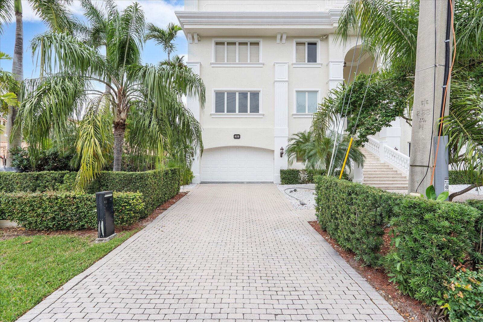 414 Riviera Isle Drive Fort Lauderdale, FL 33301 - Photo 6 of 70 a front view of a house with a yard