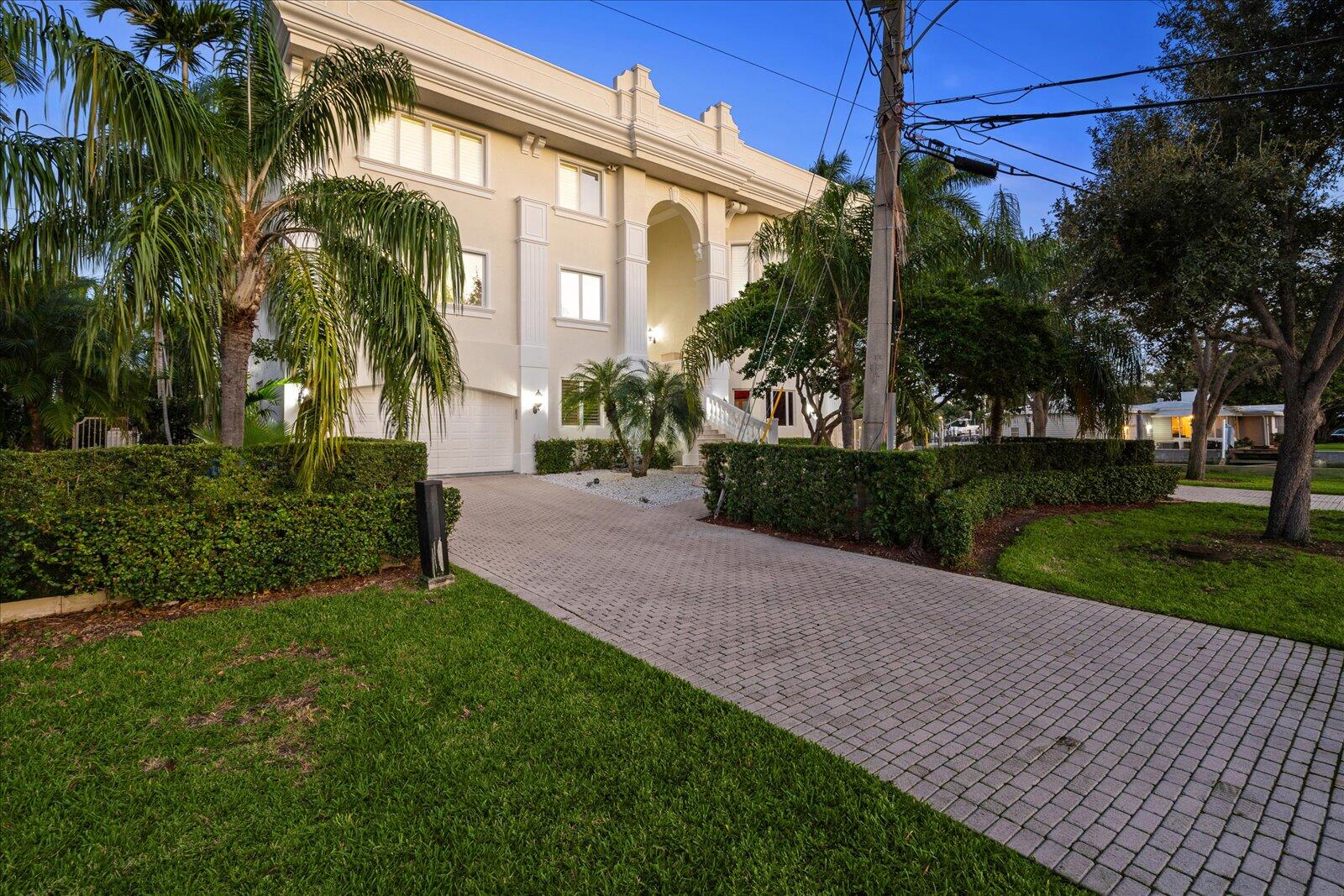 414 Riviera Isle Drive Fort Lauderdale, FL 33301 - Photo 68 of 70 a front view of a house having yard