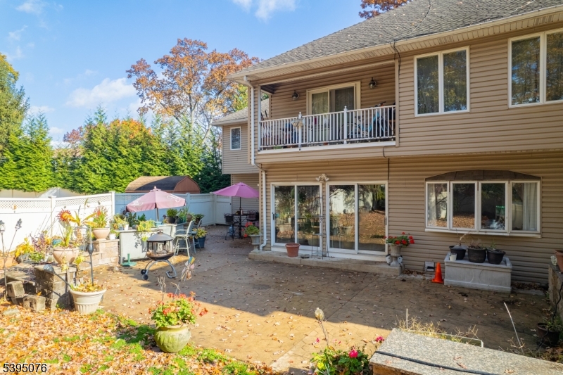 24 Woodland Road Clark, NJ 07066 - Photo 29 of 45 a view of a house with a patio