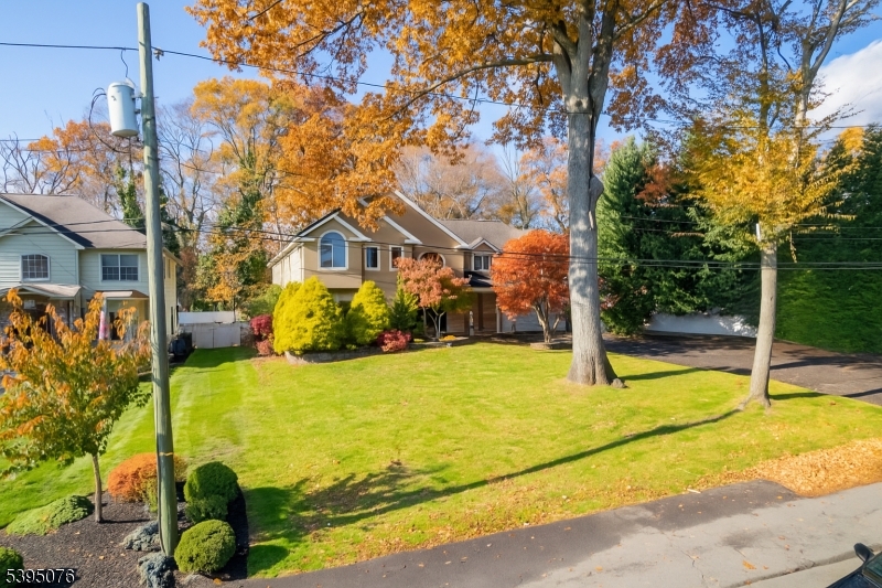 24 Woodland Road Clark, NJ 07066 - Photo 30 of 45 a view of a house with pool and a yard