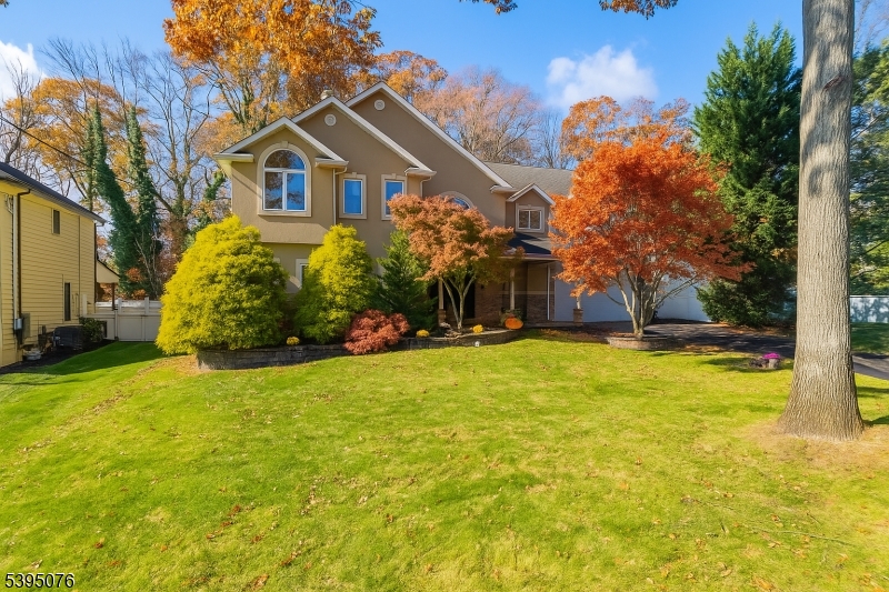 24 Woodland Road Clark, NJ 07066 - Photo 31 of 45 a front view of a house with a yard