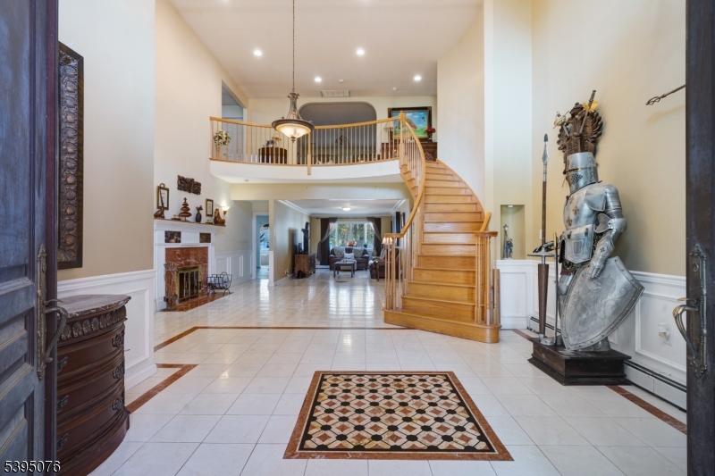 24 Woodland Road Clark, NJ 07066 - Photo 5 of 45 a hallway with a dining table and sofas