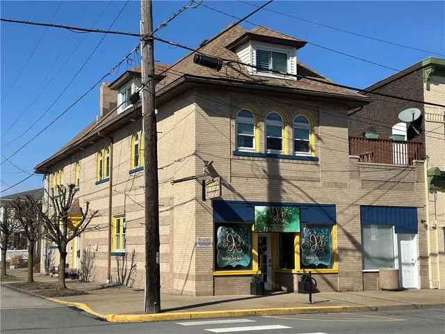 a view of a building with a street