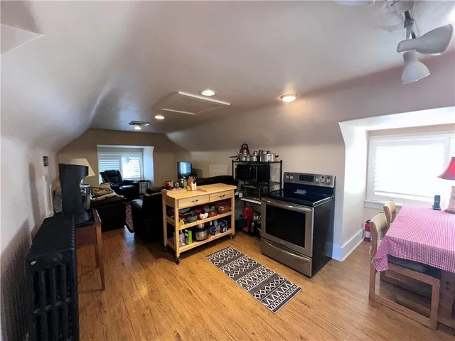 a kitchen with stainless steel appliances granite countertop a stove and cabinets