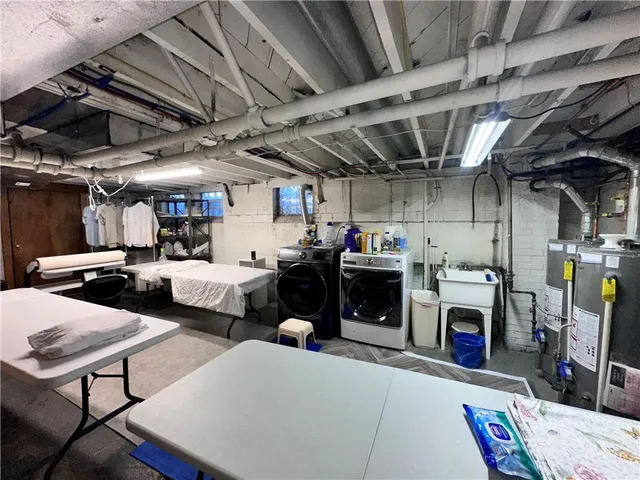 a bed room with furniture and a chandelier