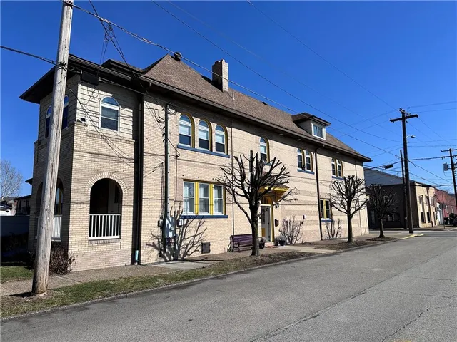 a front view of a house with a porch