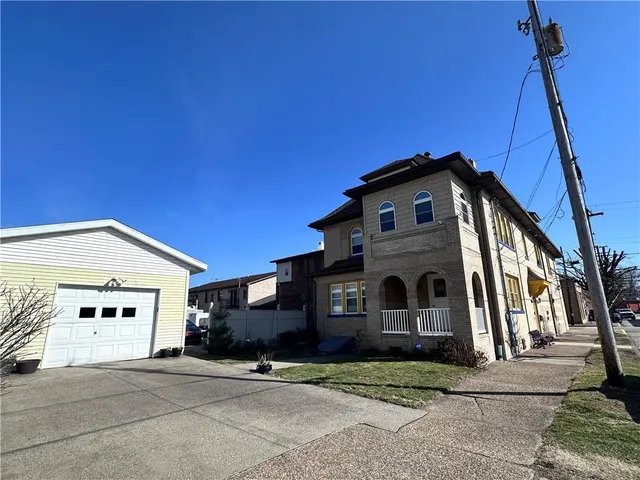 a view of a building with a yard